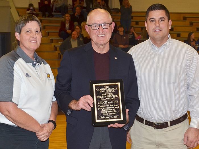 Chuck Vaughn, former Campbellsville Independent Schools superintendent, was inducted into the 5th Region Athletic Director’s Hall of Fame on Saturday, Feb. 4. He was honored during the CHS boys’ basketball game versus Metcalfe County. From left are CHS Assistant Athletic Director Katie Wilkerson, Vaughn and CHS Principal Kirby Smith. (CHS photo by Calen McKinney)