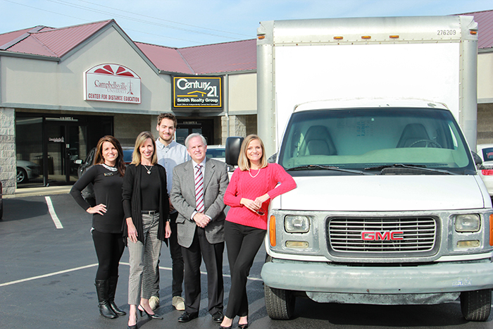 Century 21 Smith Realty Group donates a truck to Campbellsville University. From left are Amanda Long, Realtor; April Smith, principal broker; Stephen Olliges, Realtor; Otto Tennant, vice president for finance and administration and Renee Dobson, Realtor. (Campbellsville University by Joshua Williams)