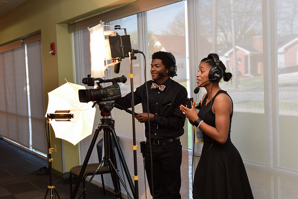 From left, Lionel Jones and Lexxus Graham, work on cameras for the 9th Annual Derby Rose Gala at Campbellsville University. (Campbellsville University Photo by Joshua Williams)