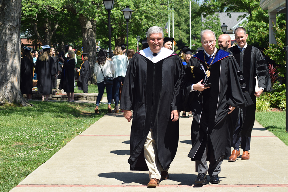 From left: Henry Lee, chairman of Campbellsville University’s Board of Trustees, Dr. Michael V. Carter, president, and Max Wise, Kentucky State Senator, 16th Senatorial District, lead the senior walk for the commencement ceremony at Campbellsville University. (Campbellsville University Photo by Kyrsten Hill) 