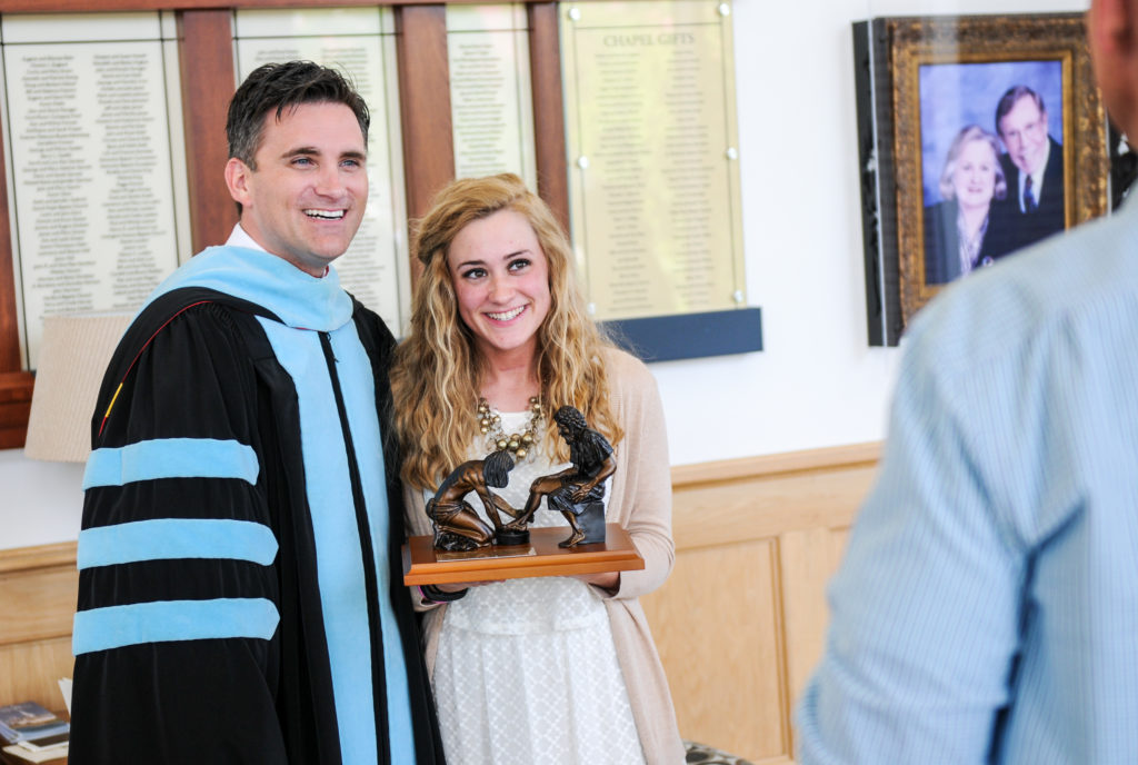 From left, Dr. Shane Garrison, vice president for enrollment services, and Rachel Mobley of Elizabethtown, Ky., take a photo together after the Honors and Awards Day at Campbellsville University. (Campbellsville University Photo by Joshua Williams)