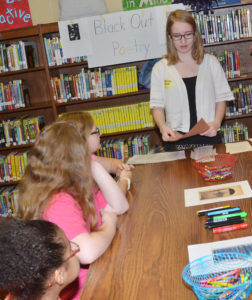 Keilah Coverstone, CU student, teaches CMS fourth-graders about Black Out poetry, which is created by “blacking out” words and letters contained in something already written to write something new. (Campbellsville Independent School photo by  Calen McKinney)