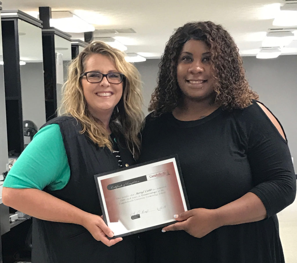 At left, Suzanne Zahrndt, Instructor of Cosmetology at The Brockman Center, presented Aeryl Cobb with her certificate of completion of the cosmetology program. Cobb is the first student to graduate since the cosmetology program at The Brockman Center opened in March 2016.