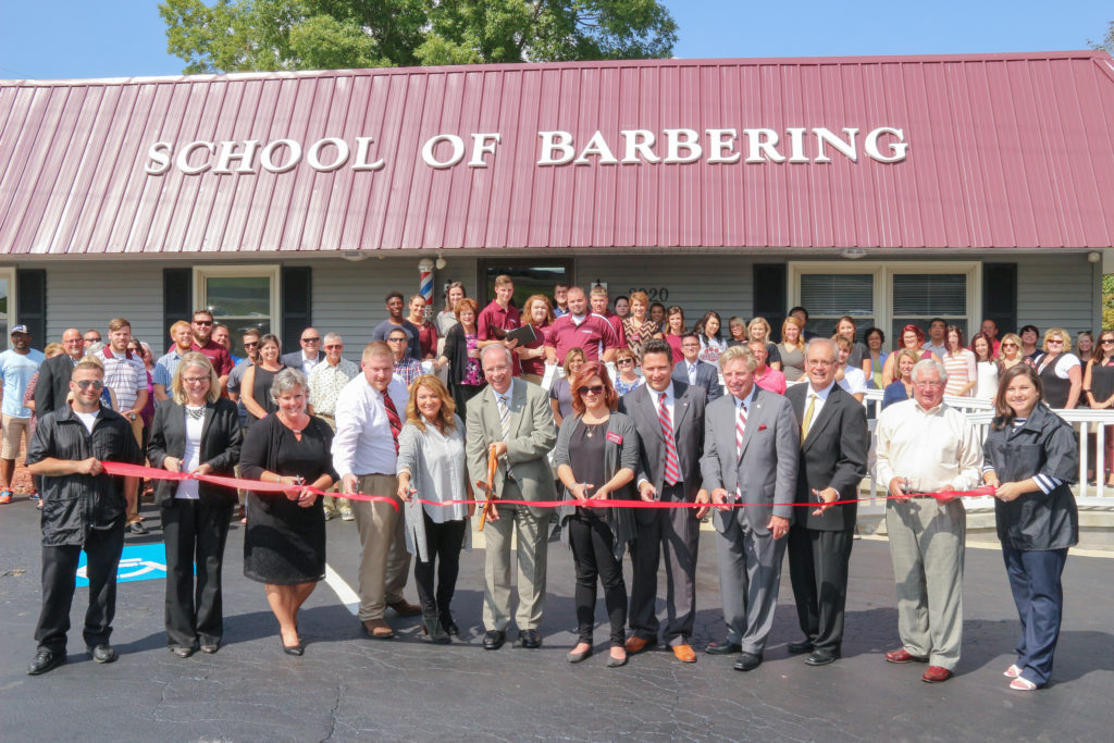 Cutting the ribbon for the new Campbellsville University School of Barbering were from left: Ricky Burton, barbering student; Dr. Donna Hedgepath, provost and vice president for academic affairs; Sonja Minch, barbering board administrator; Paul Wilson, barbering board chairman; Beulah Morgan, lead barbering instructor; Dr. Michael V. Carter, president of Campbellsville University; Amanda Roop, director of School of Cosmetology; Jason Roop, director of the Virginia Ponser Flanagan Technology Training Center; Dr. G. Ted Taylor, vice president for university outreach; Campbellsville Mayor Tony Young, Taylor County Judge-Executive Eddie Rogers and barbering student Ashley Coppage. (Campbellsville University Photo by Drew Tucker)