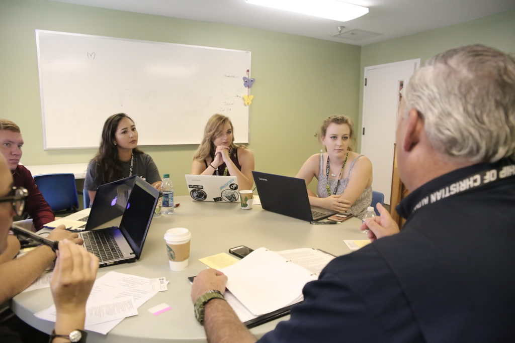 <span class="s1">Breanne Ward, fourth from left, listens while broken into a small group discussion session during the Ethics Symposium. (Photos by Keagan Thein, Ethics Symposium Activities Coordinator)</span>