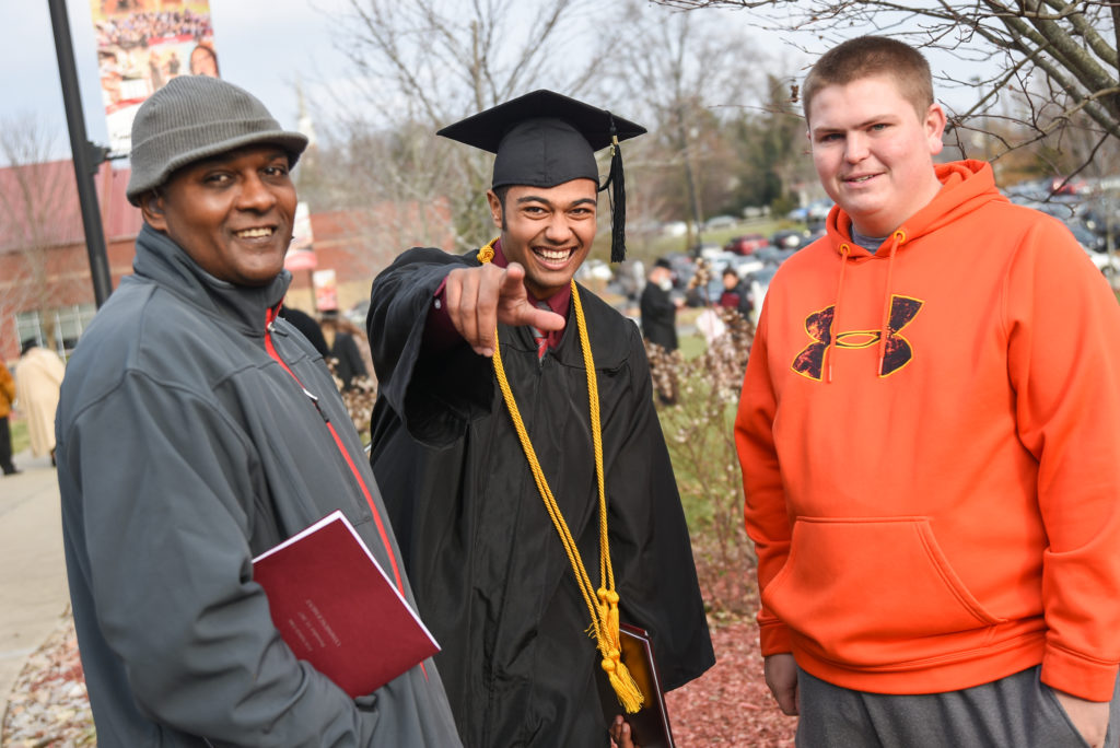 From left, Francis Thurman and Cory Ater, third from left, enjoy a commencement moment with Christian Thurman of Elizabethtown, Ky. (Campbellsville University Photo by Joshua Williams)