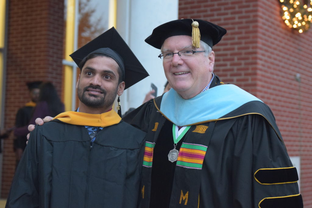 From left, Gangishetty Saikiran Goud of India takes a photo with Dr. H. Keith Spears, vice president for communications and assistant to the president, after his graduation ceremony at Campbellsville University. (Campbellsville University Photo by Andrea Burnside)