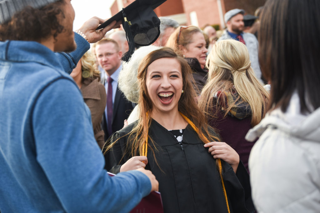Sarah Stults of Sonora, Ky. laughs after her commencement Friday, Dec. 15 from Campbellsville University. She received a bachelor of science in psychology graduating magna cum laude. (Campbellsville University Photo by Joshua Williams)