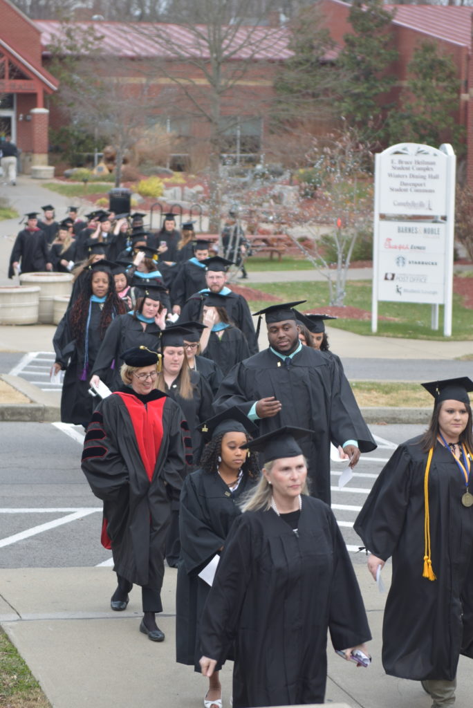 A tradition, the graduate walk, takes place from Davenport Student Commons as Dr. Helen Mudd, dean of the Carver School of Social Work, was among the faculty walking. (Campbellsville University Photo by Andrea Burnside)