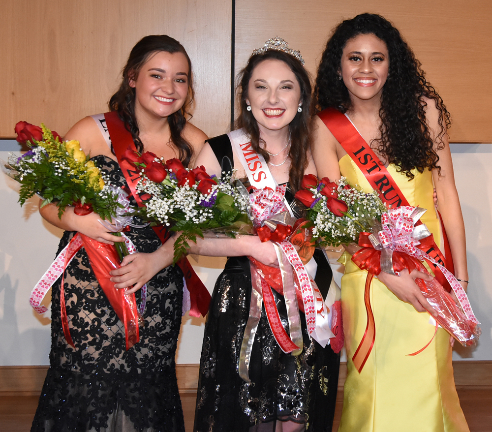 Winners in the annual Valentine Pageant tonight at Campbellsville University were Cassie Emery, center, Queen; Maiya Henderson, right, first runner-up, and Rebekah Mobley, left, second runner-up. Emery represented Baptist Campus Ministry and is a junior from Cloverport, Ky. Henderson is a freshman from Bowling Green, Ky., and she represented the Black Student Association. Mobley is a sophomore from Elizabeth- town, representing the Office of Enrollment Services. Emery will represent Campbellsville University in the annual Kentucky Mountain Laurel Festival in Pineville, Ky., May 24-27. (Campbellsville University Photo by Ariel Emberton)